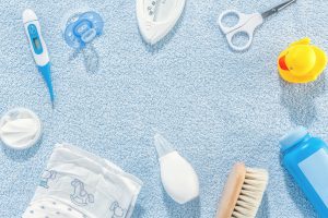 Baby care accessories on blue background
